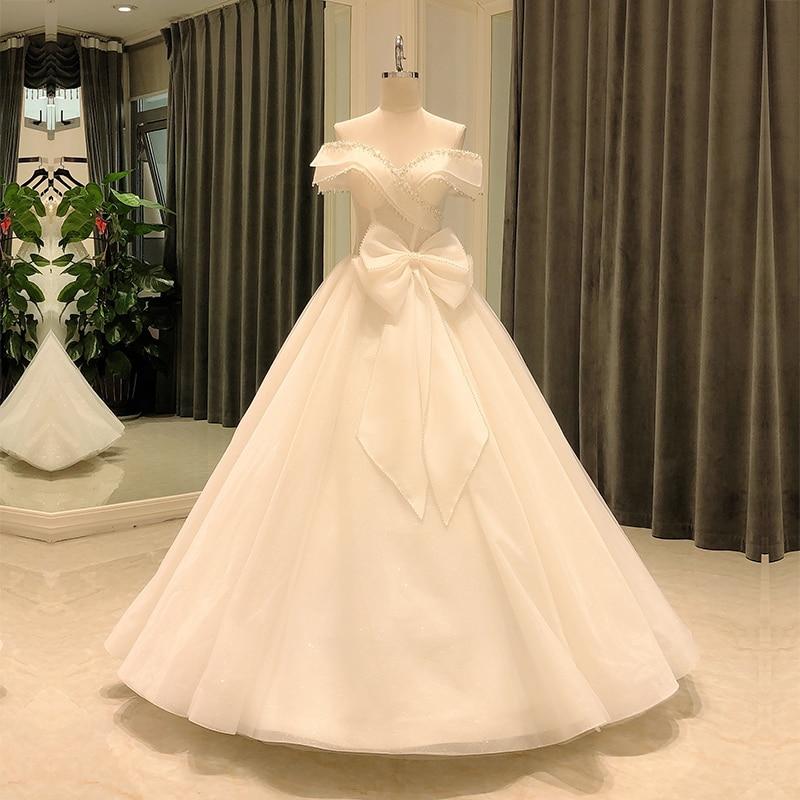 Elegant off Shoulder Short Sleeve Crystal Bow Decorated Wedding Gowns - SolaceConnect.com