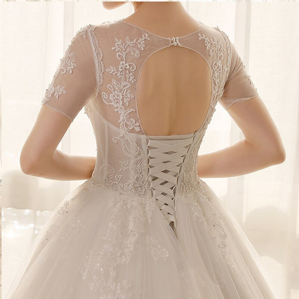 Lace Short-Sleeved Ball Gown Princess Wedding Dress with Appliques and Crystals - SolaceConnect.com