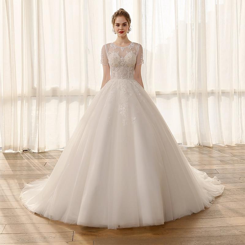 Lace Short-Sleeved Ball Gown Princess Wedding Dress with Appliques and Crystals  -  GeraldBlack.com